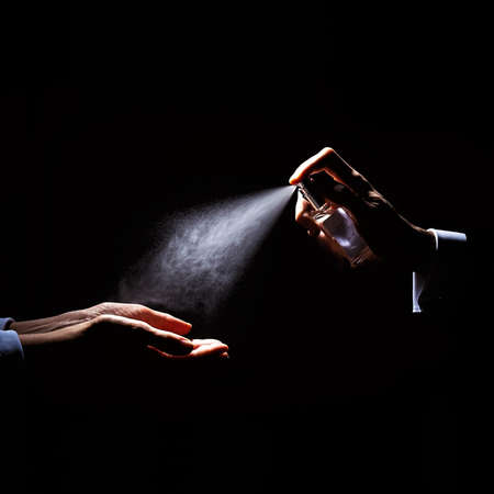 Washing hands with fumes, in the dark background.の写真素材