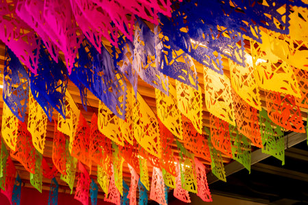 A colorful display of paper lanterns hangs from the ceiling. The colors are bright and cheerful.