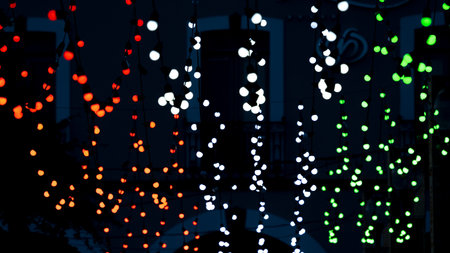 A display of colorful lights hanging from the ceiling, creating a lively and festive ambiance....