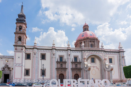 A large, white building with a pink dome. Historic center of Queretaro, colonial architecture,...