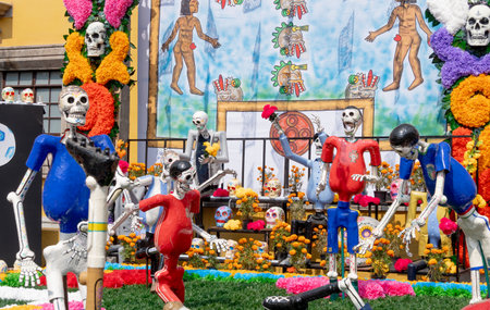A group of skeletons are playing soccer on a field. The skeletons are dressed in red. Mexican Day of the Dead tradition, offerings, food, colors, decorations, and papel picado, La Catrina.の写真素材
