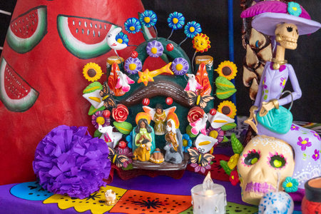 A table with a skull, a mannequin, and a mannequin with a flower on it.Mexican Day of the Dead tradition, offerings, food, colors, decorations, and papel picado, La Catrina.の写真素材