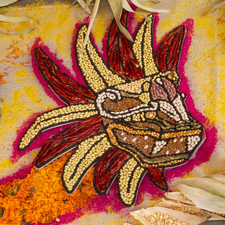 A colorful mosaic of a dragon made of beans and rice. The dragon is surrounded by a yellow background.の写真素材