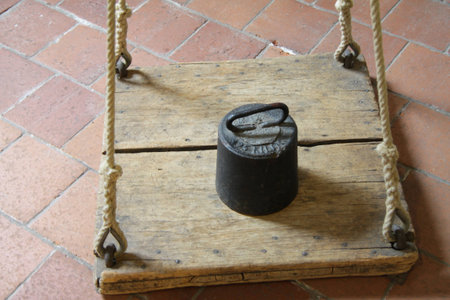 Wheight on a wooden scaleの写真素材