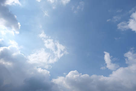 Dutch blue sky with clouds and sun raysの写真素材