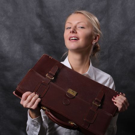 Woman holding leather briefcaseの写真素材