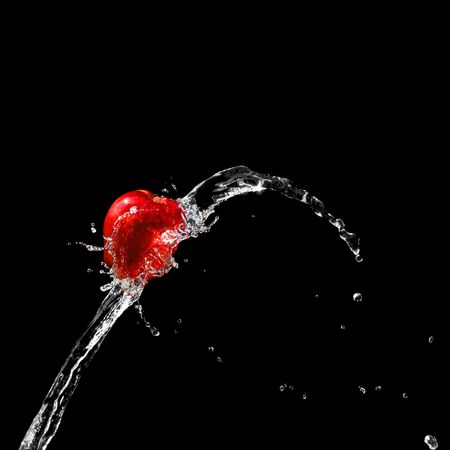 Red ripe apple in water streamの写真素材