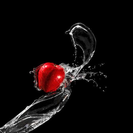 Red ripe apple in water streamの写真素材