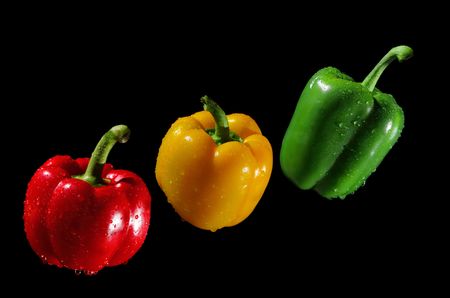 Three peppers on black backgroundの写真素材