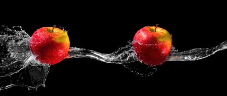 Two apples in water streamの写真素材
