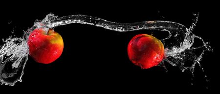 Two apples in water swirlの写真素材