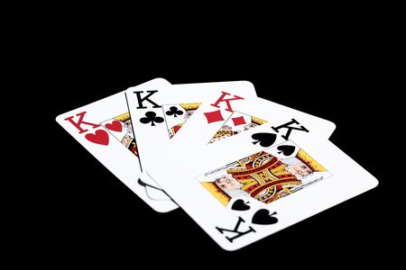 Four kings on black background