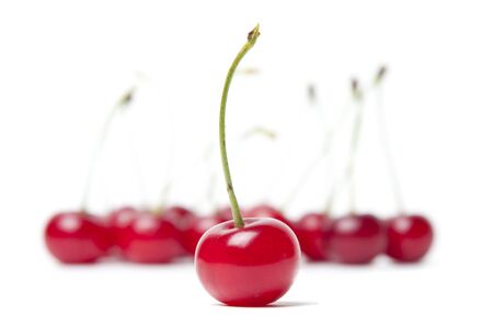 Cherry isolated on white with fruit background の写真素材