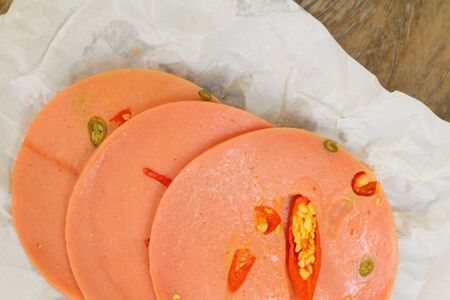 Spicy Bologna sausage on a background - foodの写真素材