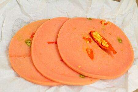 Spicy Bologna sausage on a background - foodの写真素材