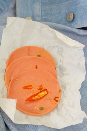 Spicy Bologna sausage on a background - foodの写真素材