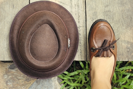 Vintage brown leather shoes with hatの写真素材