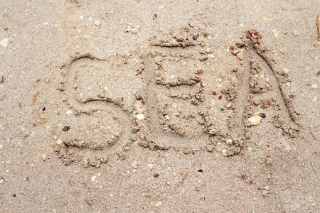 Written word sea on the beach sand.の写真素材