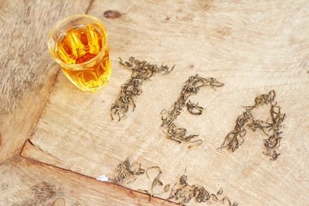 Hot tea with tea leavesの写真素材