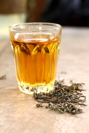 Hot tea with tea leavesの写真素材