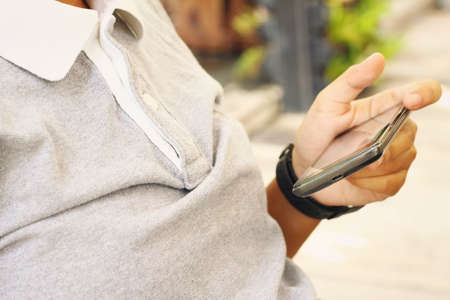 man Using smart phone - technology equipment.の写真素材