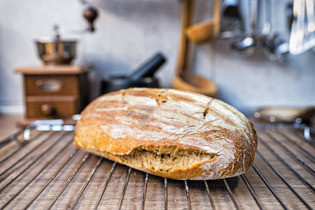 freshly baked sourdough bread removed from the ovenの写真素材