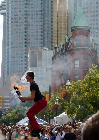 Toronto, Canada, August 2011 - Acrobats performing at Buskerfest street fairのeditorial素材