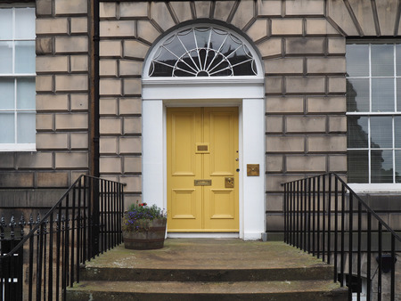 yellow door of old stone buildingのeditorial素材