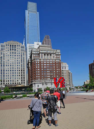 Philadelphia, USA - May 27, 2019:  Tourists line up to be photographed with Philadelphia's pop art Love sculpture.のeditorial素材