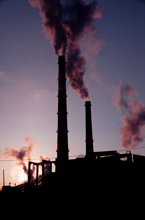 Silhouette of a steam plantの写真素材