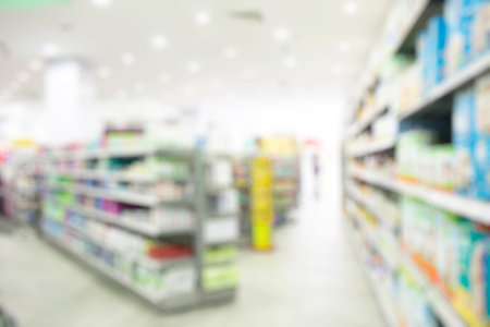 Abstract blur shopping mall. Large store with many shelves and many products on themの写真素材