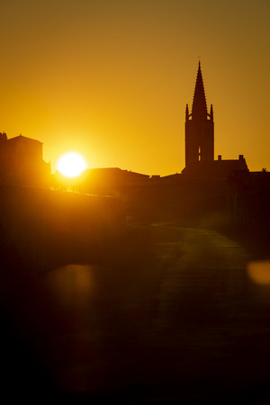 sunrise on the steeple of the church and village of Saint Emilion, Religion, Gironde, Franceの写真素材