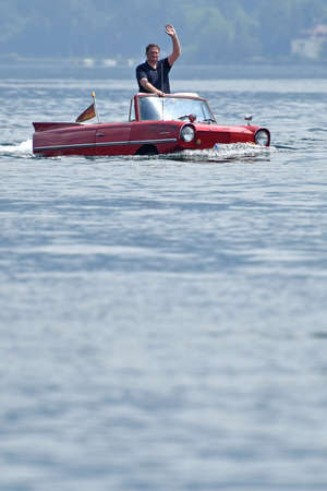Every year in the Salzkammergut, owners of swimming cars and amphibious vehicles from all over Europe meet on a weekend in June, here at Attersee (Salzkammergut).のeditorial素材