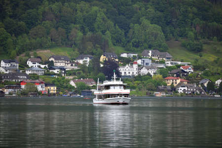 Passenger boat on. Traunsee - The Traunsee is the deepest lake in Austria with a depth of 191 m. It...