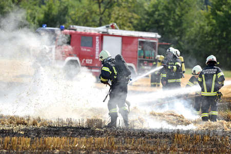 Because of the great summer heat, a field ignites and starts to burn