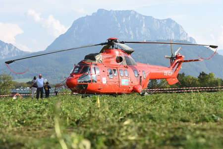 Helicopter Aerospatiale AS 332 with the Traunstein in the background
