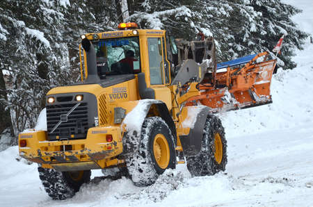 Snow removal (winter service) with a truck in the Salzkammergutのeditorial素材