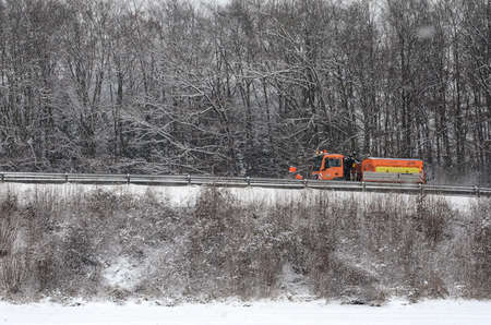 Snow removal (winter service) with a truck in the Salzkammergutのeditorial素材