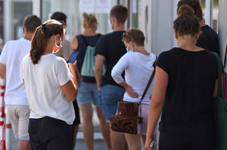 Queue in front of a shop during the pandemic in Austria, Europe