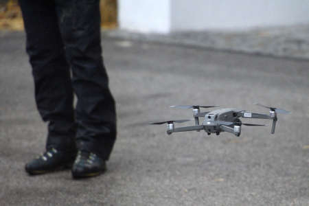 A flying drone taking off from the ground, Austria, Europe