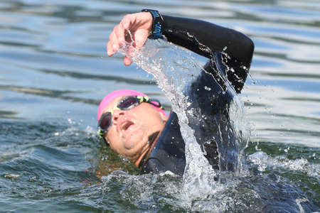 Triathlon is an endurance sport, consisting of an all-around competition of the disciplines swimming, cycling and running, which must be completed one after the other and in exactly this order. - Triathlon is an endurance sport consisting of an all-around competition in the disciplines of swimming, cycling and running, which must be completed one after the other and in exactly this order.の写真素材