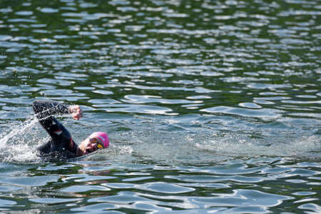 Triathlon is an endurance sport consisting of an all-around competition in the disciplines of swimming, cycling and running, which must be completed one after the other and in exactly this order.の写真素材