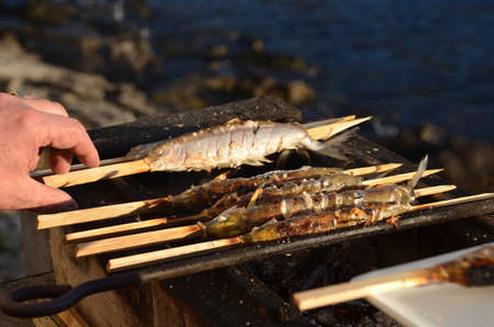 Stick fish - a grilled fish specialty in the Salzkammergut, Austria, Europeの写真素材