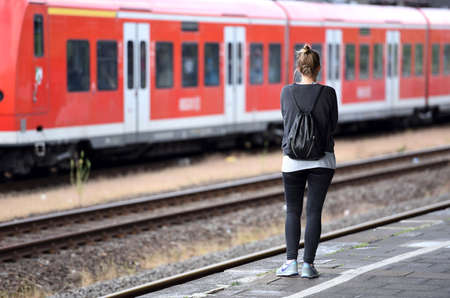 A young woman alone on the platformの写真素材