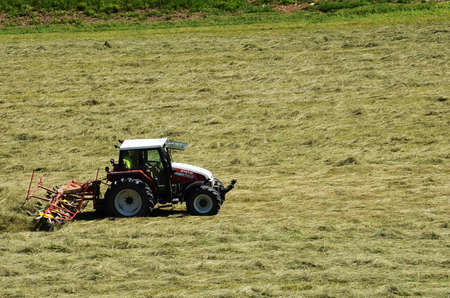 Machine turning of hay, Upper Austria, Austria, Europeの写真素材