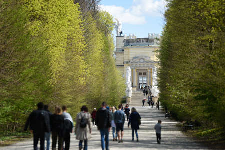 Many visitors and tourists at the world famous SchÃ¶nbrunn Palace in Vienna, Austriaのeditorial素材