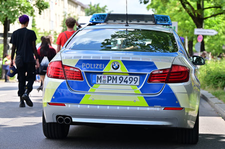 Police car at CSD Pride in Munich. The CSD parade is a political demonstration and colorful parade that takes place every year in Munich. She advocates for equal rights for gays and lesbians.のeditorial素材