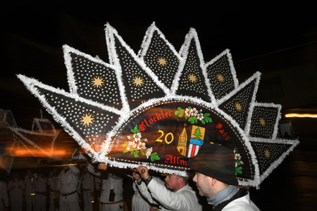 The GlÃ¶cklerlauf is an old custom around Lake Traunsee; men and women wear magnificent caps and bells to drive away the winterのeditorial素材