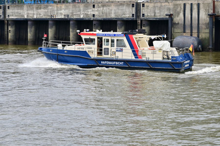A harbor supervisory boat in the port of Hamburg, Germanyのeditorial素材