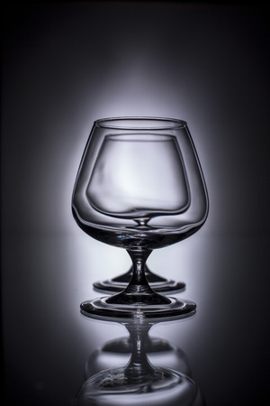 pouring brandy into a glassの写真素材